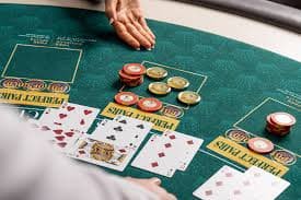 teguh777 mobile app showing Daily Bonus notification on home screen with live dealer tables in background